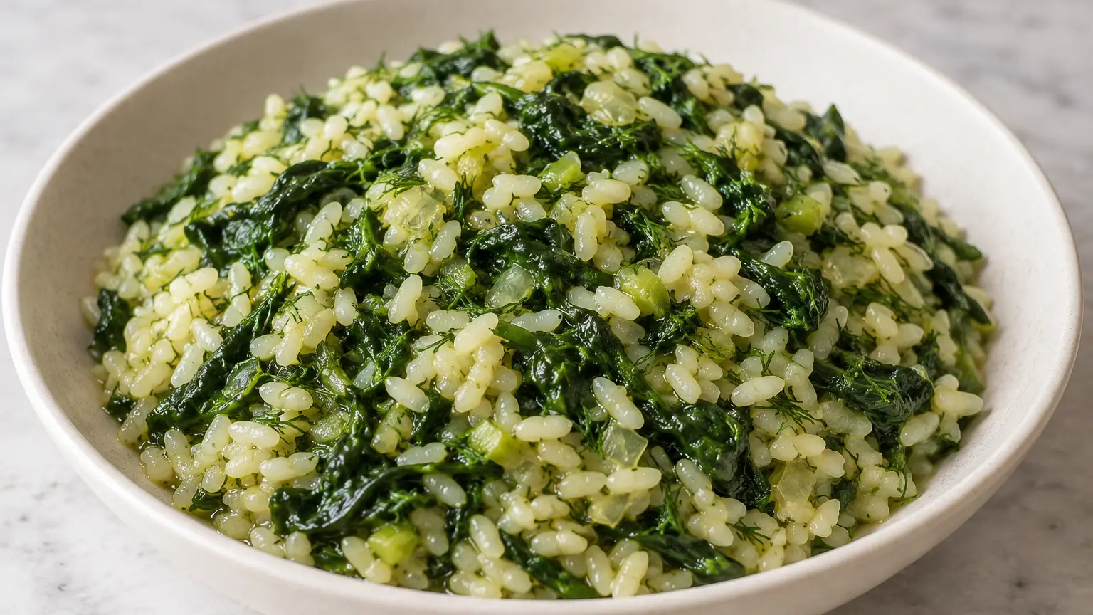 Greek spanakorizo with tender rice, plenty of spinach, fresh dill, and lemon